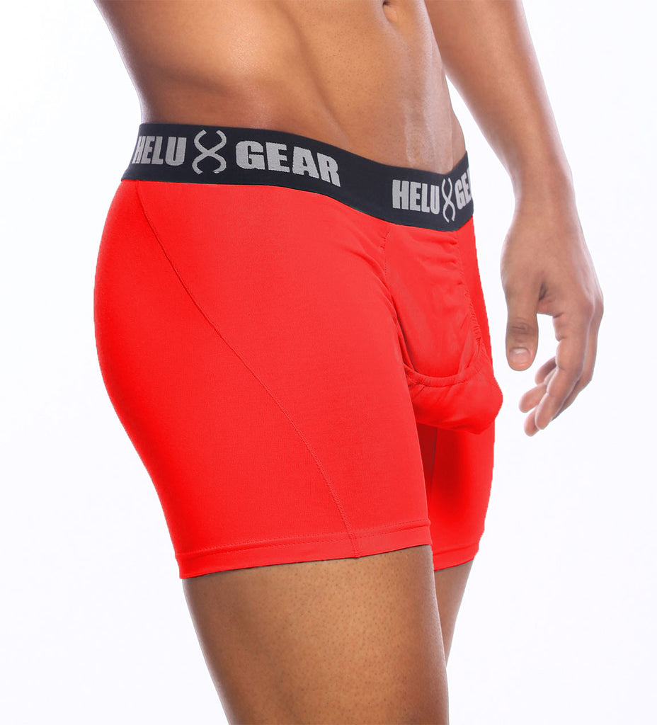 Red boxer brief underwear with an ergonomic central fly and an anatomically correct pouch, featuring the brand logo 'HELUX GEAR' on the waistband.